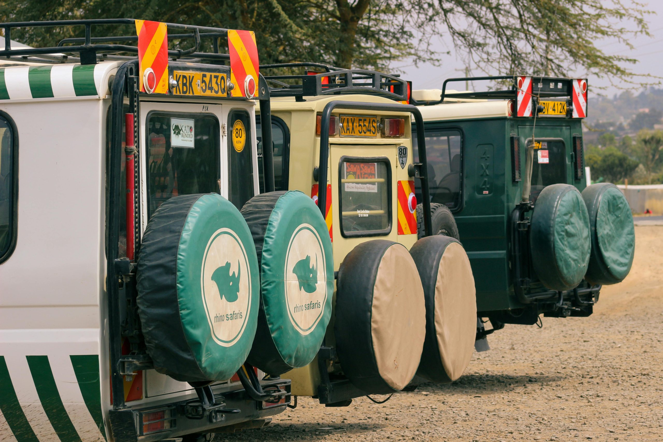 Safari jeeps parked for off-road journeys in the wilderness. Ideal for adventure seekers.